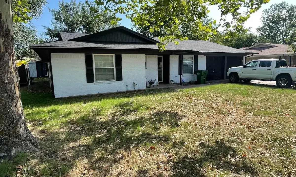 Professional roofing crew working on a residential roof in Paradise